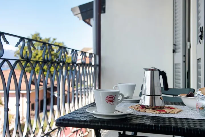 Breakfast setting on the Camelia lake-view balcony