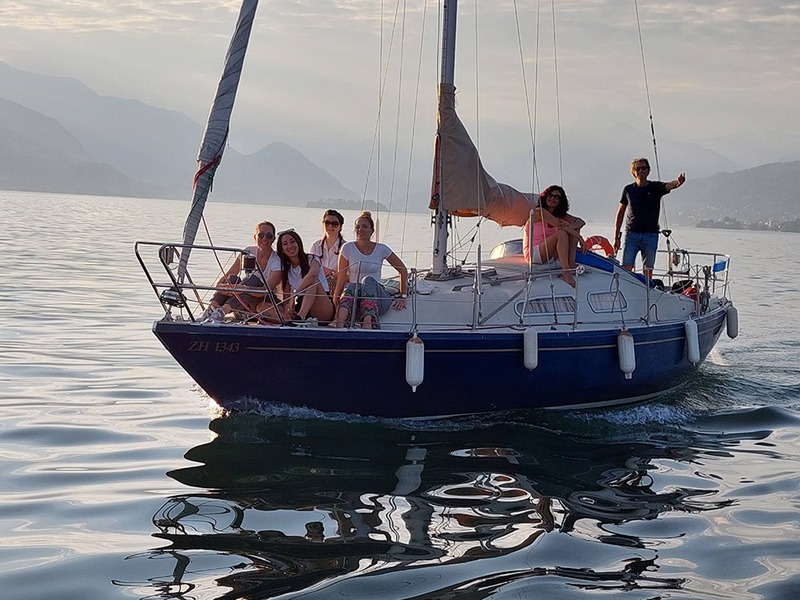 Group enjoying a sailing trip on Lake Maggiore